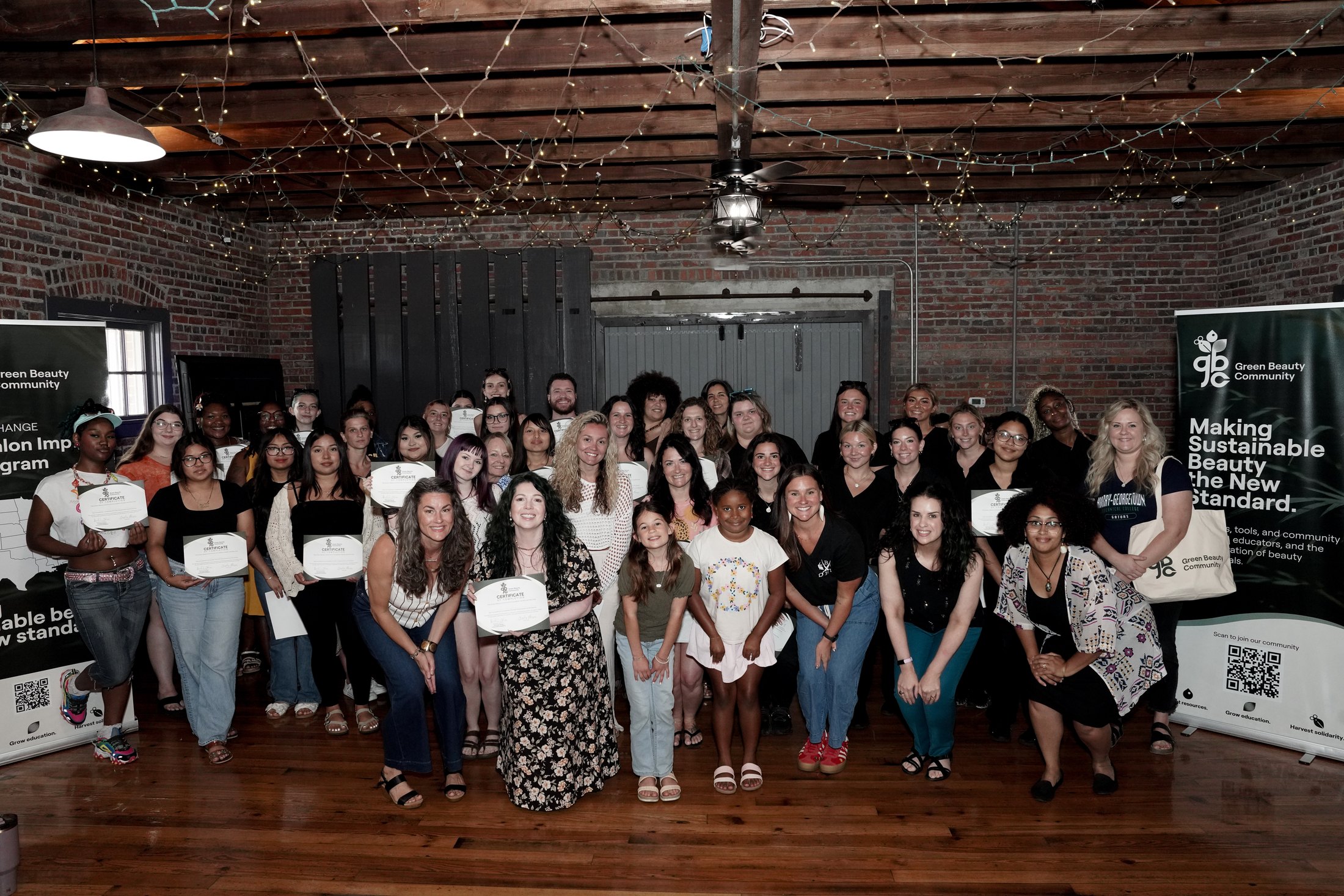 Myrtle Beach Green Salon Impact Tour participants standing together and holding certificates